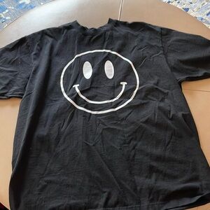 Black and white smiley face tee.  Dressed in lala size large/XL.
